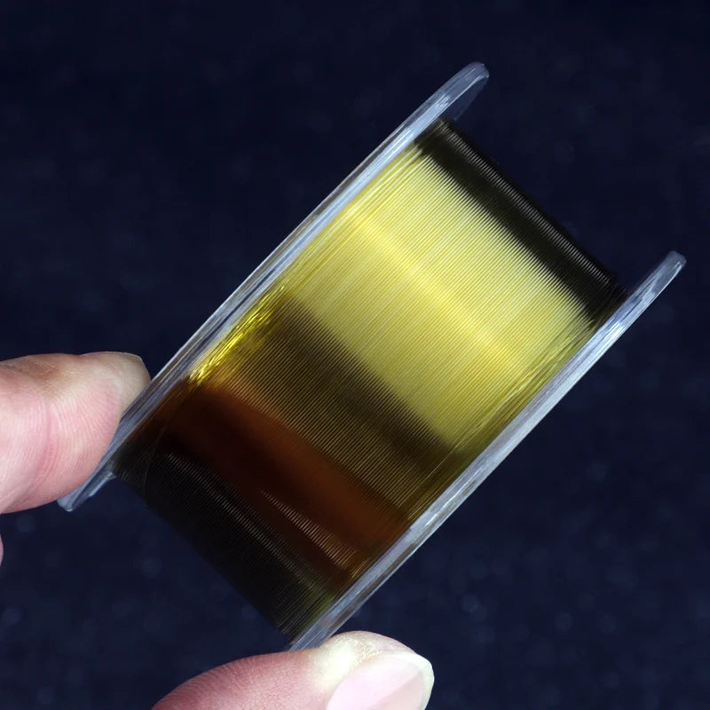 Fluorocarbon Fishing Line in Clear, Green/Bronze, and Red